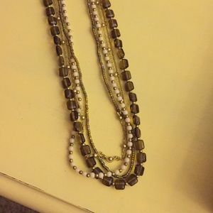 Multilayered brown and gold necklace